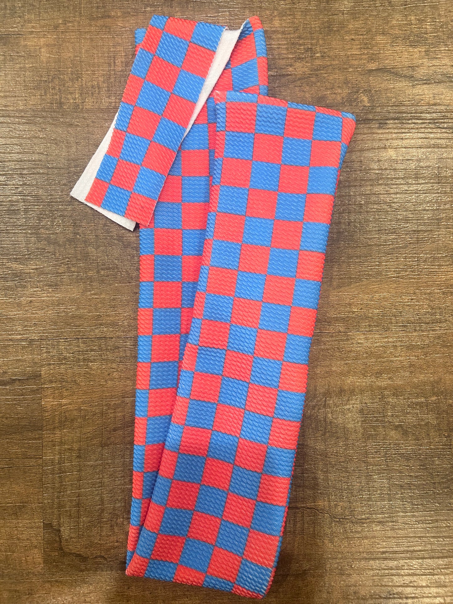 Red and Blue Checkered Tail Bag
